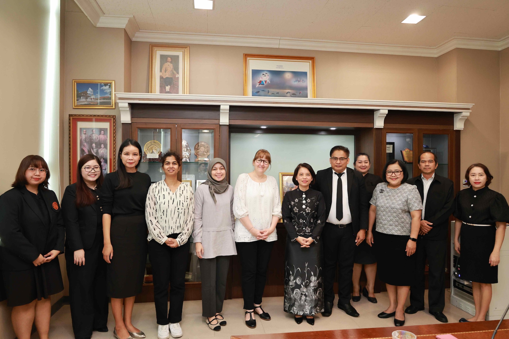 A group photograph of Crossref staff and members of the National Library of Thailand team at the National Library of Thailand